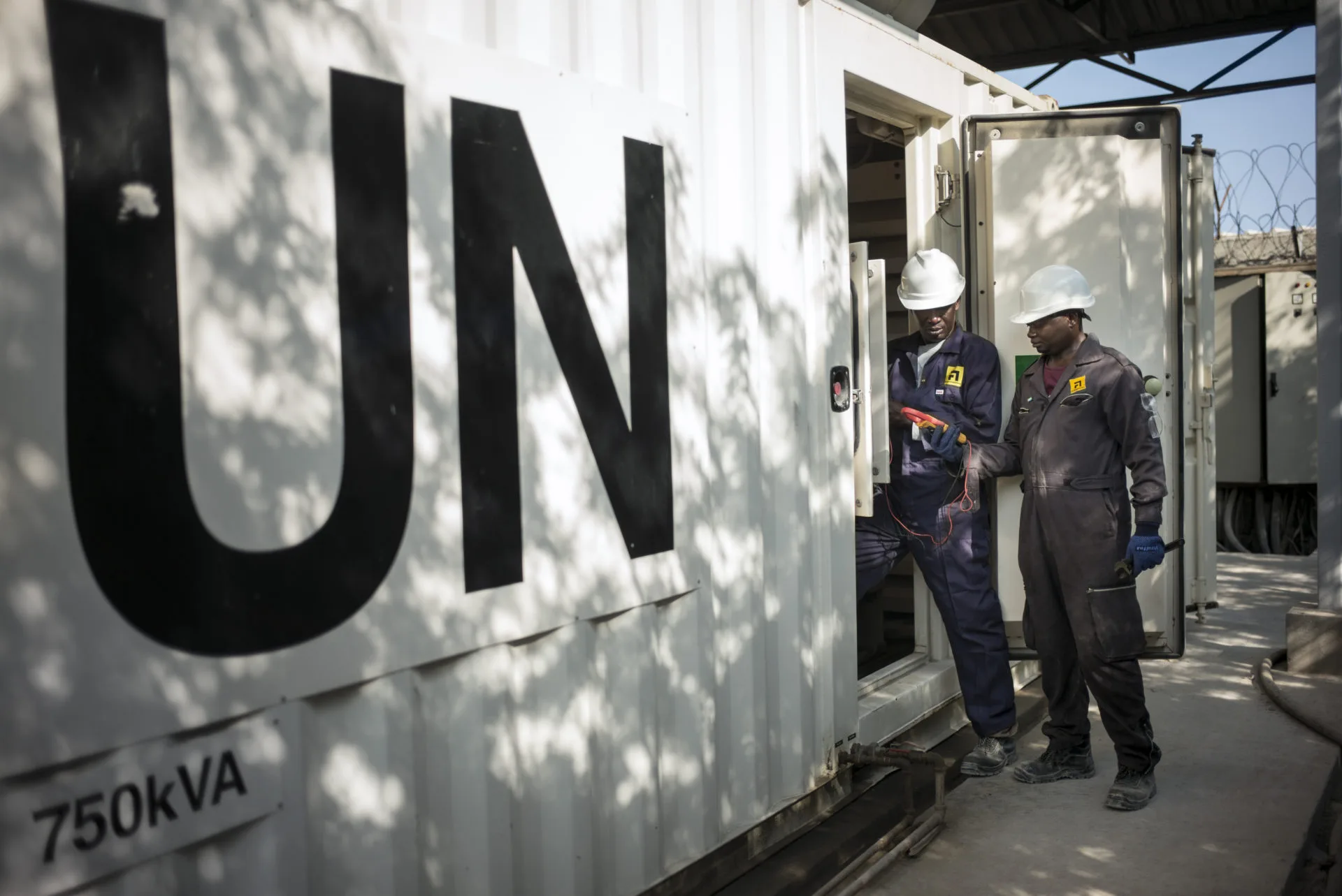 UN facility with two technicians working